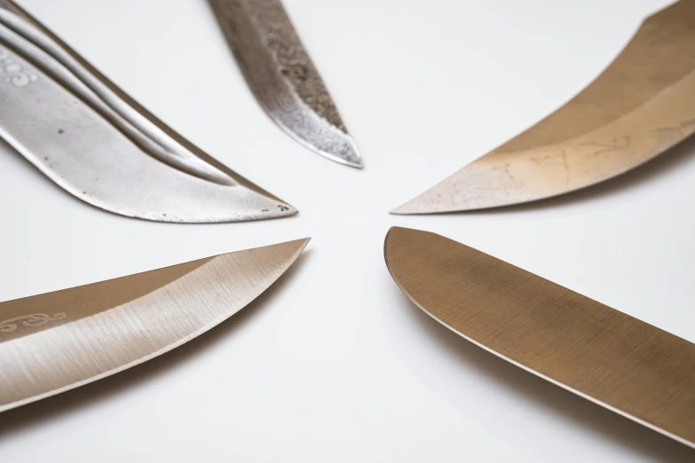 a picture of a bunch of knives lying on a table