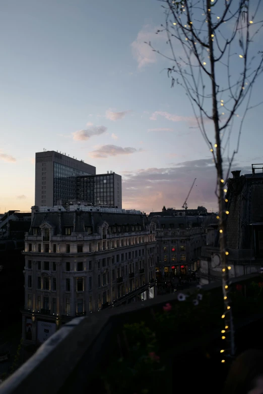 a view of a city skyline and buildings with lights