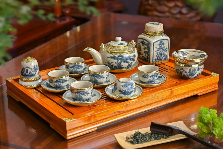 a tray with china cups and a tea set