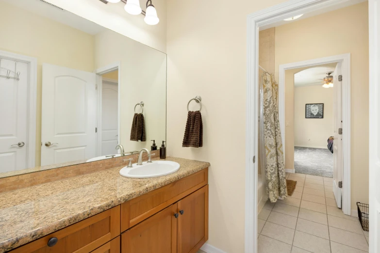 a bathroom with wooden countertops and two white doors