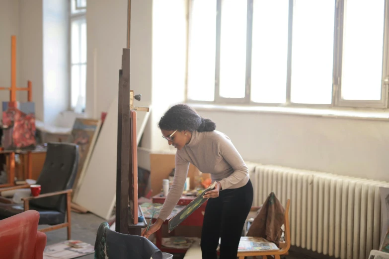 a person with an umbrella in a room with many objects