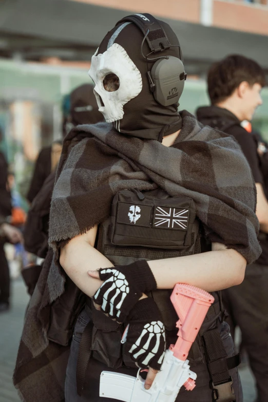 a person is wearing a costume with a face mask and arm glove