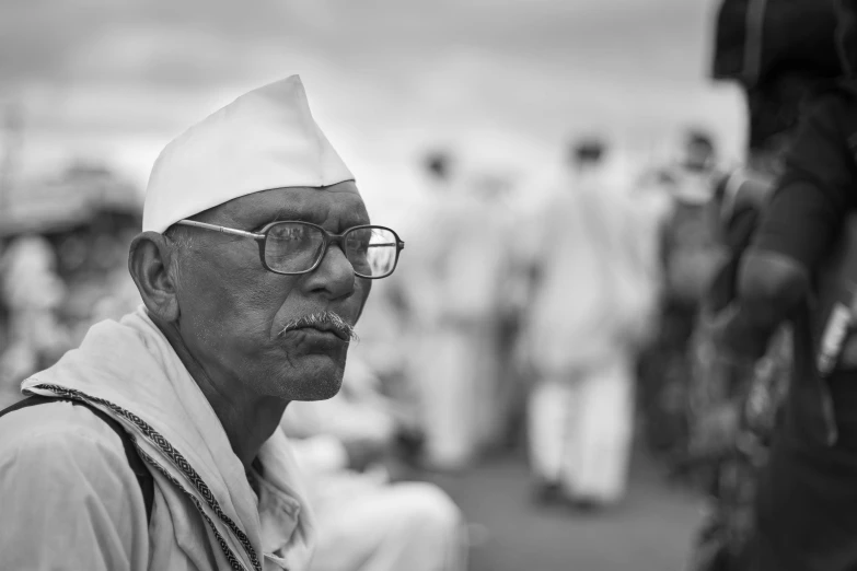 a black and white po of a man in a hat