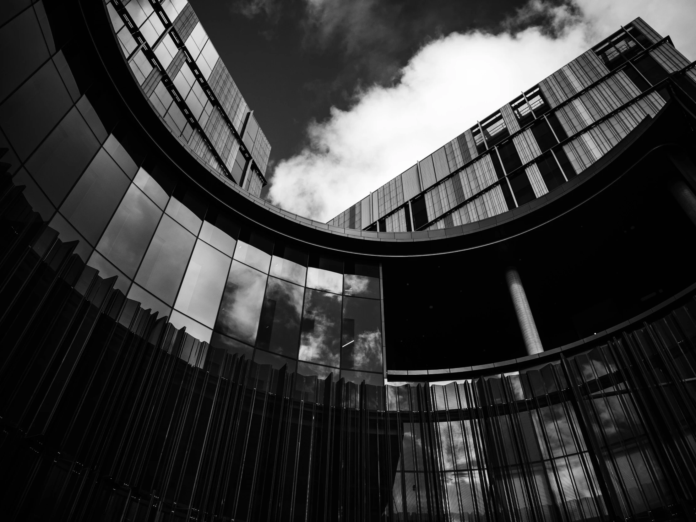 a building with glass and a round window