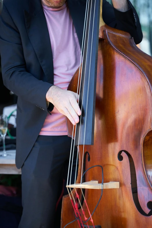 a man holding on to an instrument that is sitting on a table