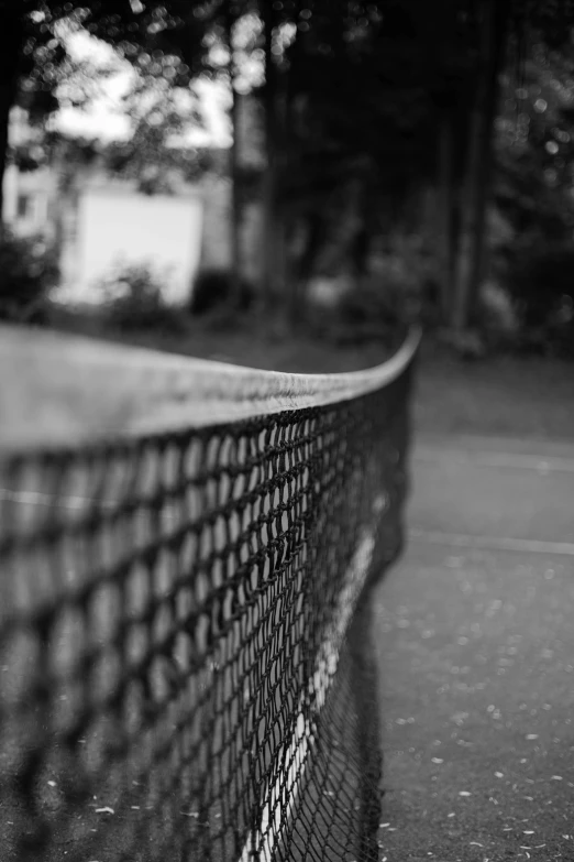 black and white pograph of a tennis court net