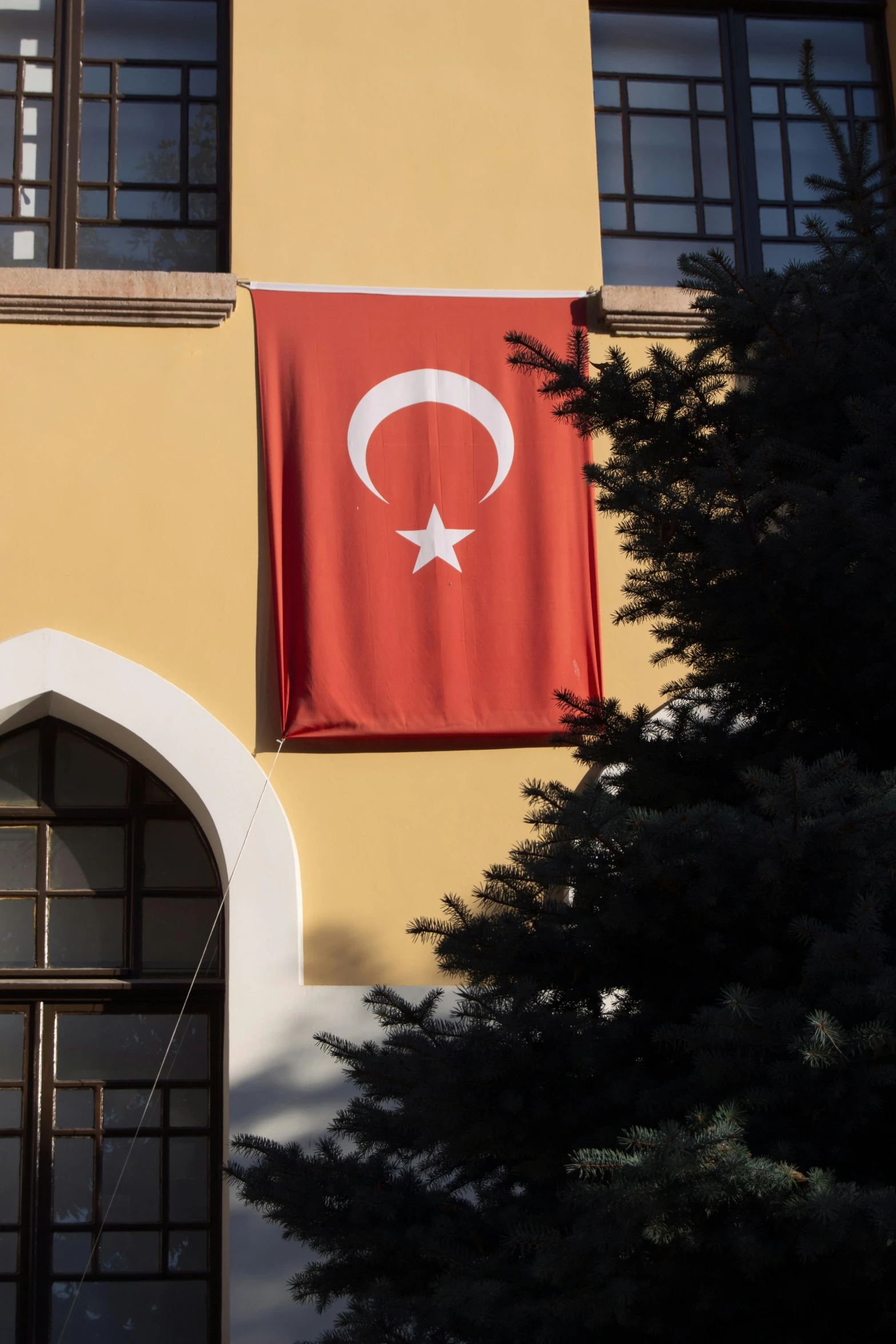 the flag on the building is red and white