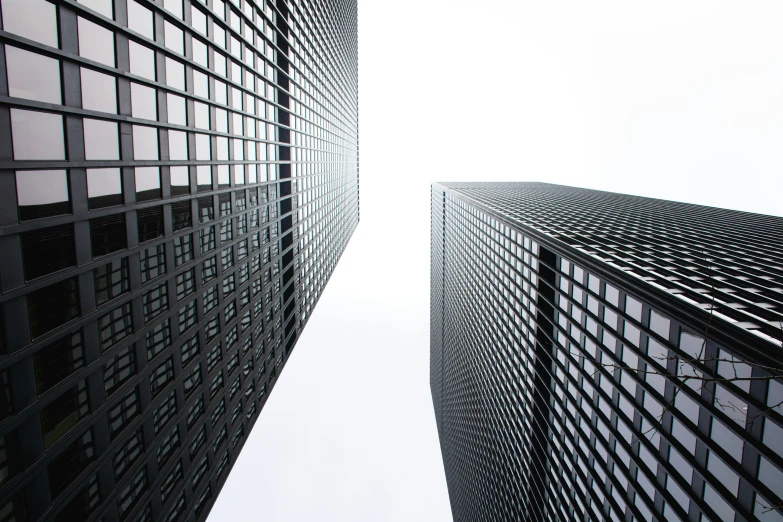 looking up at the architecture of a large and tall building