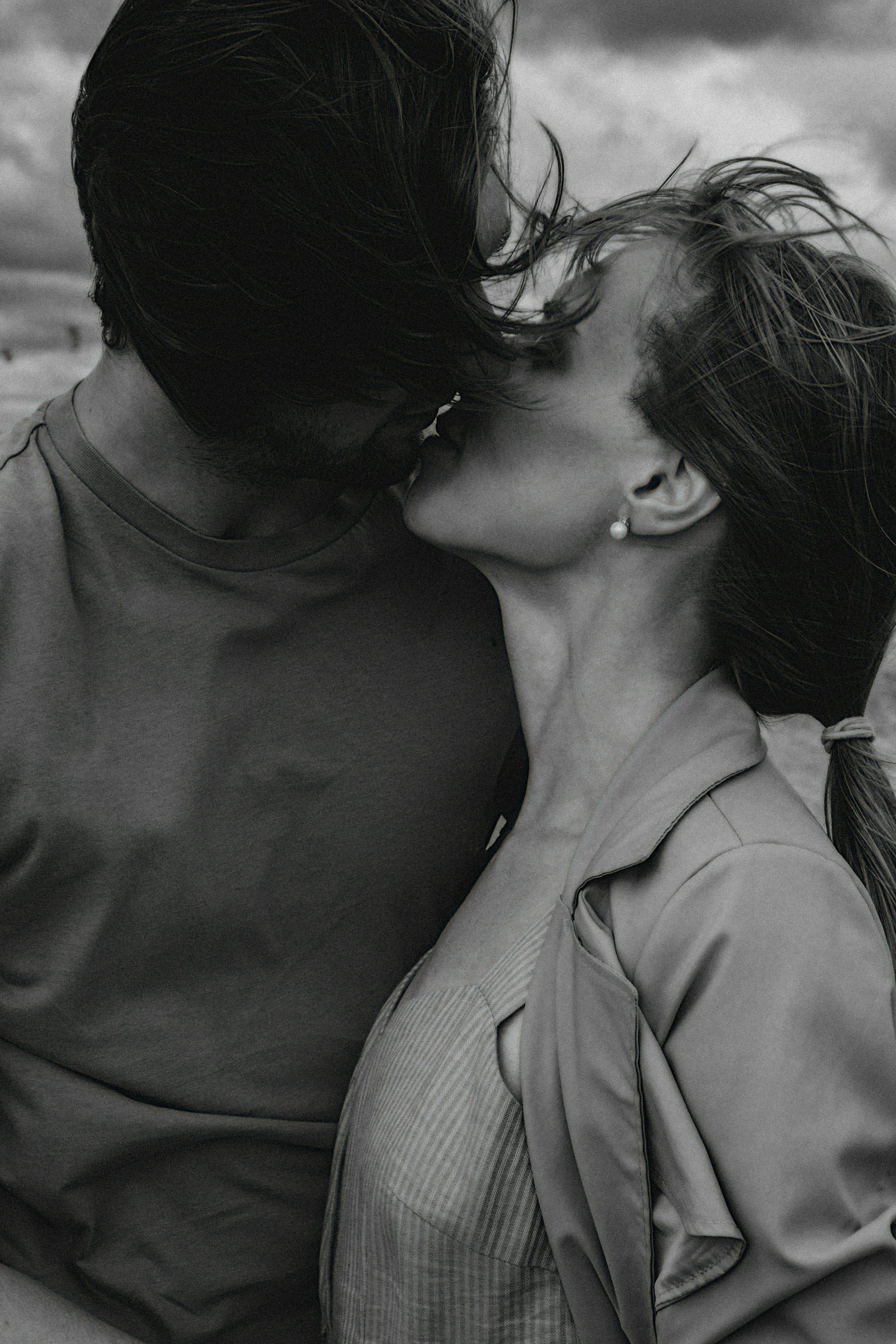 a black and white po of two women sharing a kiss