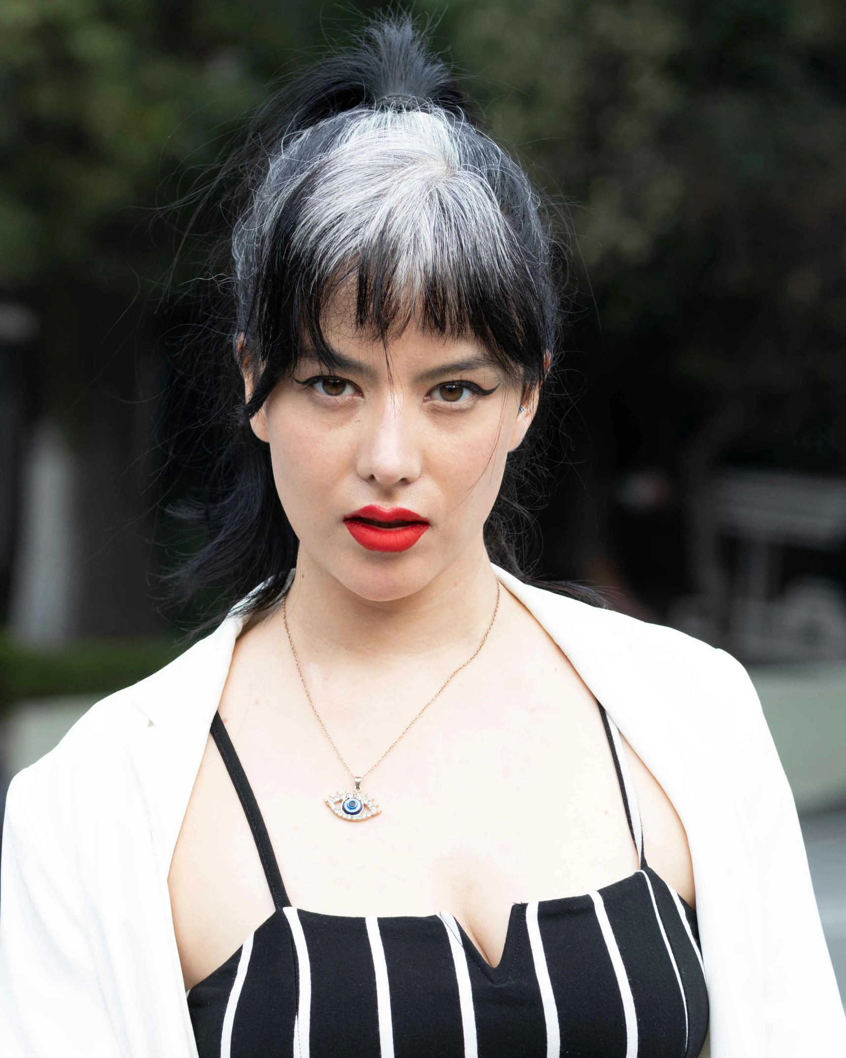 the woman is posing for a po wearing red lipstick