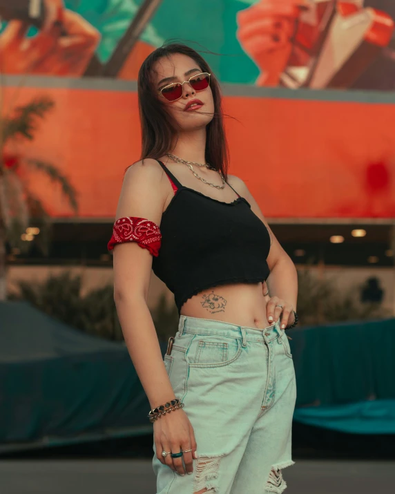 a girl with a black shirt and some red sunglasses