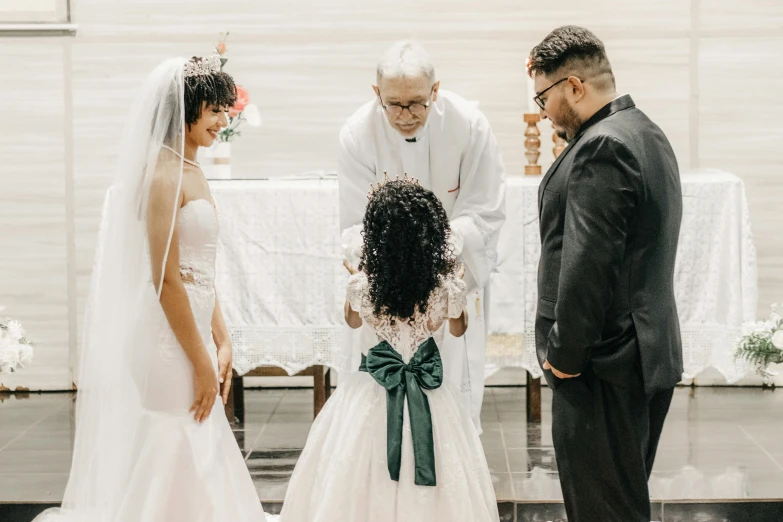 the woman is wearing a white wedding gown