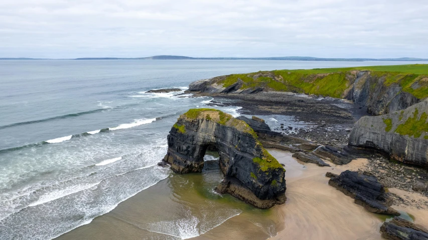 an old beach has a green grass on it