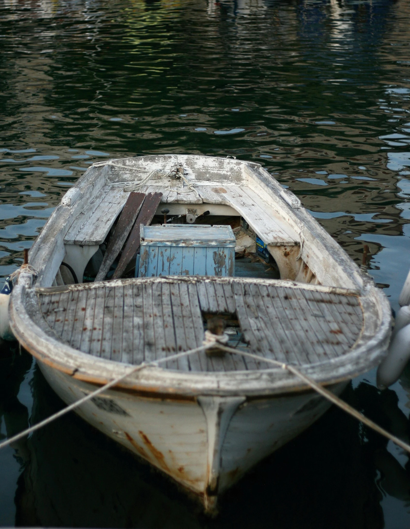 an old boat is sitting in the water