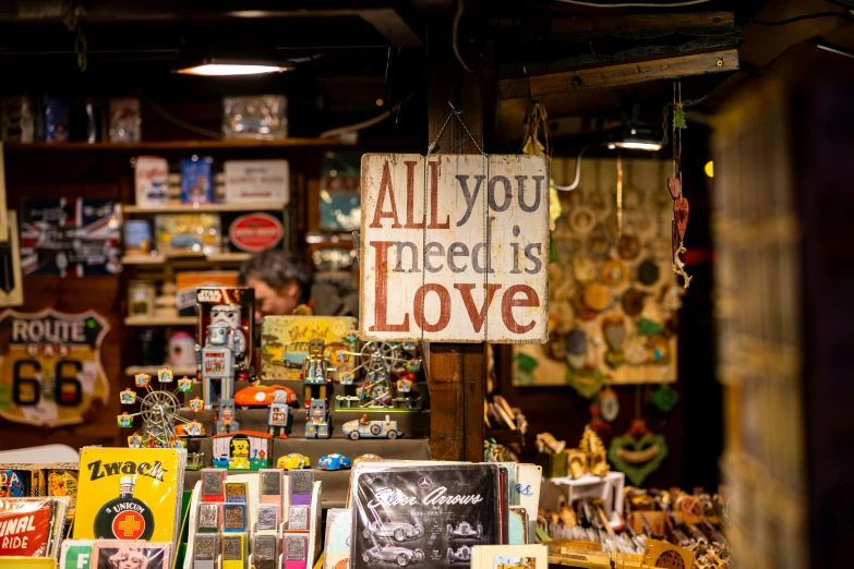 a store with signs, posters, candles and many other items