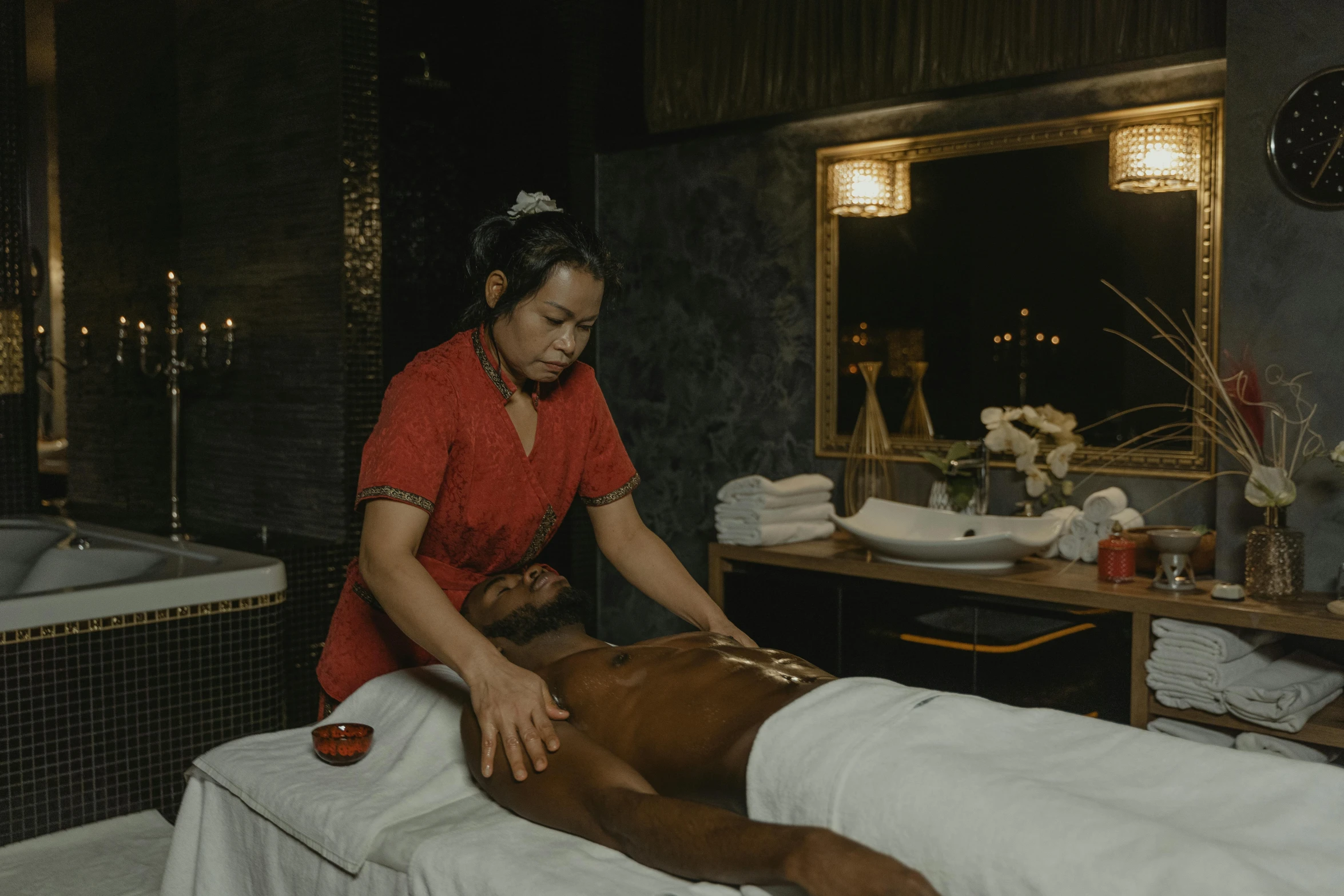 a woman having a massage in the middle of a room