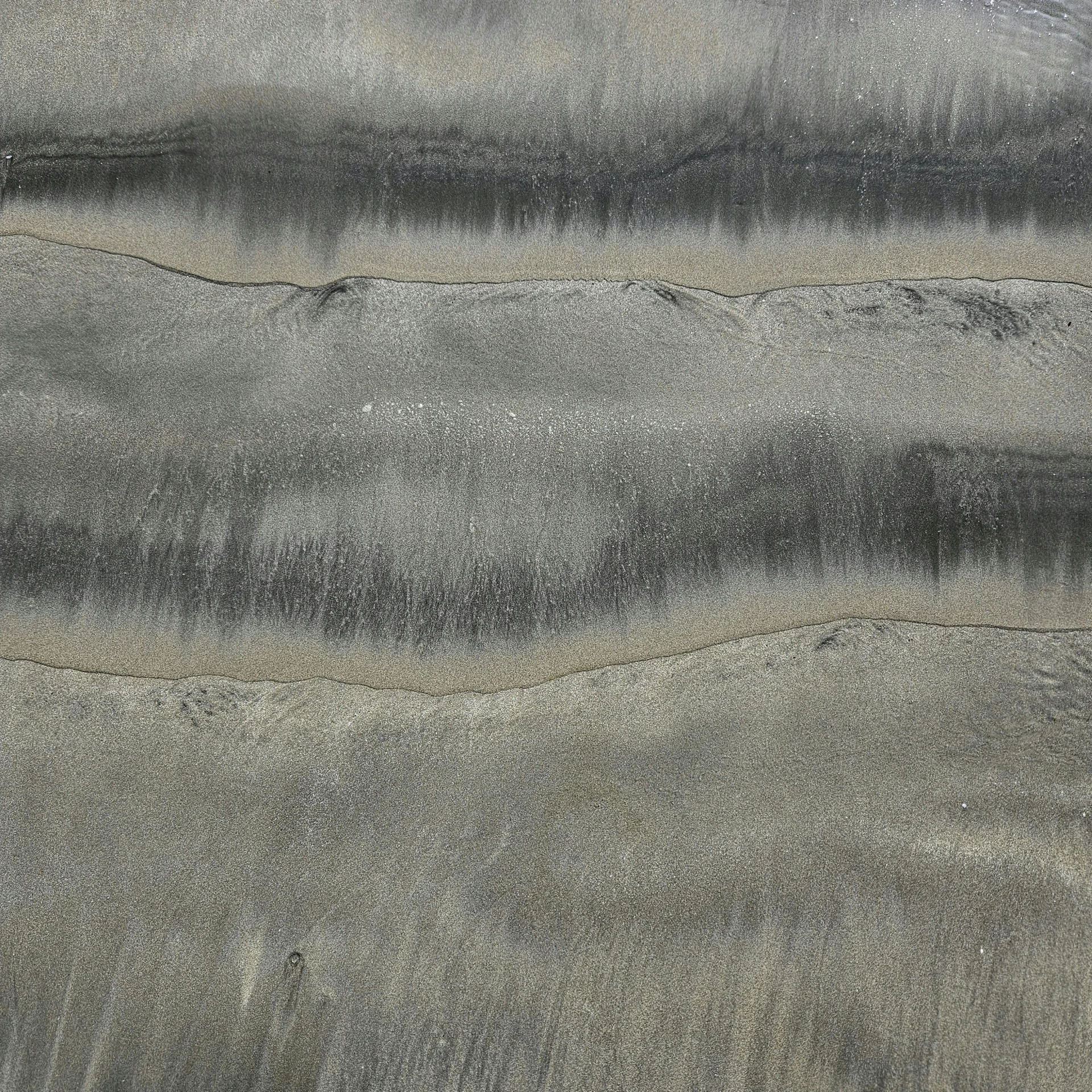 a po of grey colored rocks and sand