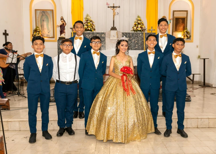 a bride poses with a few other students at their wedding