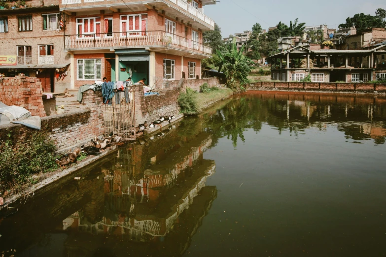 a river is going through the city with several buildings on either side