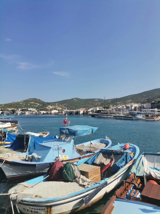 a view of many boats in a harbor near water