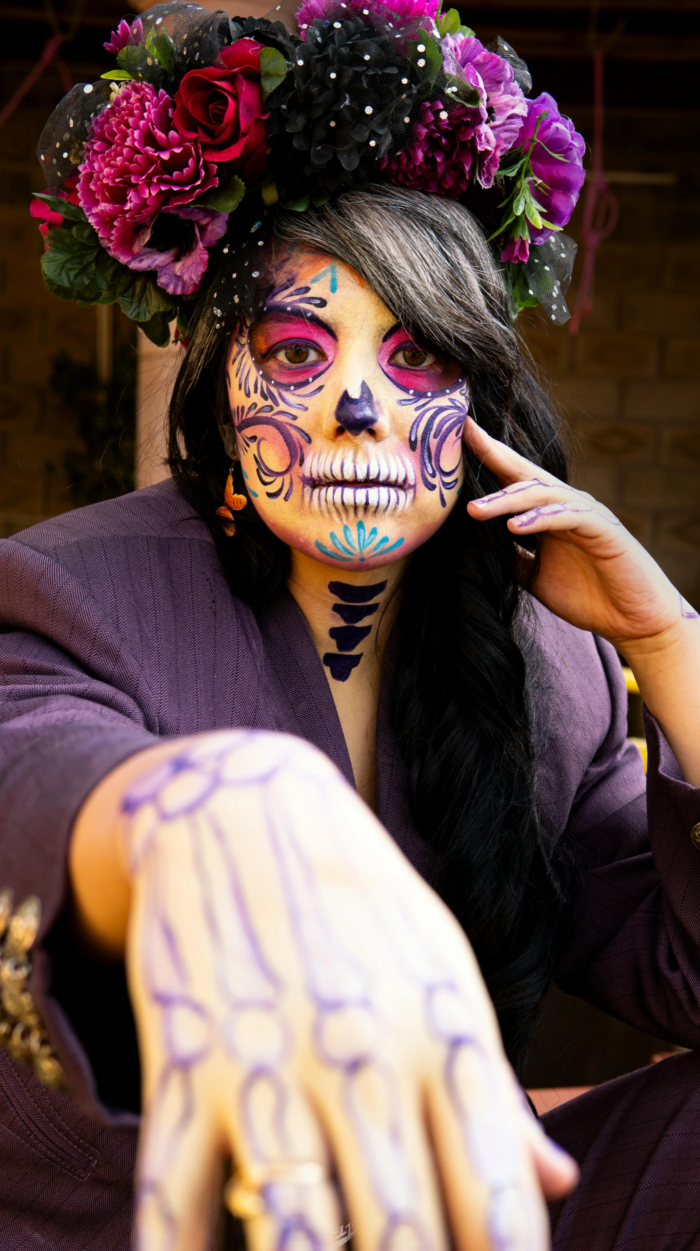 a young woman with skeleton paint and flowers