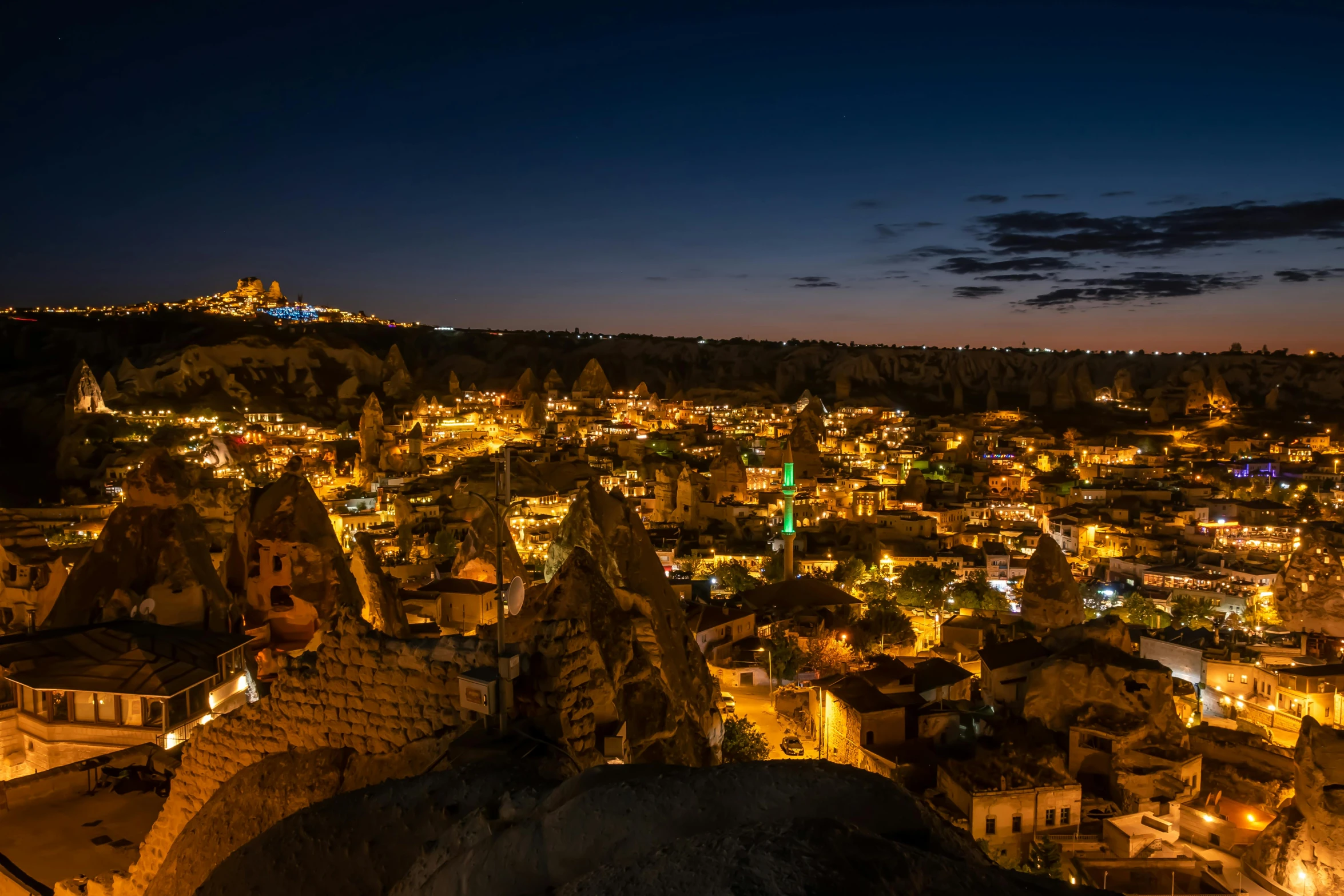 a city in the evening lights up at night