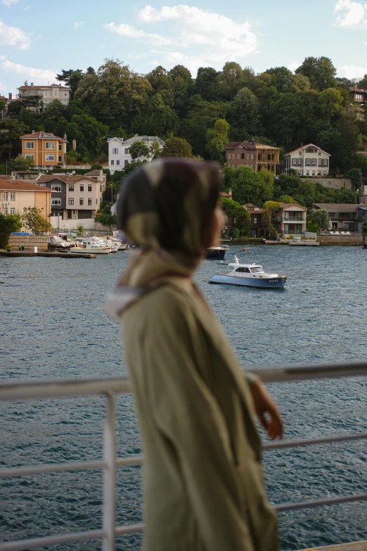 a man is overlooking the water and boats