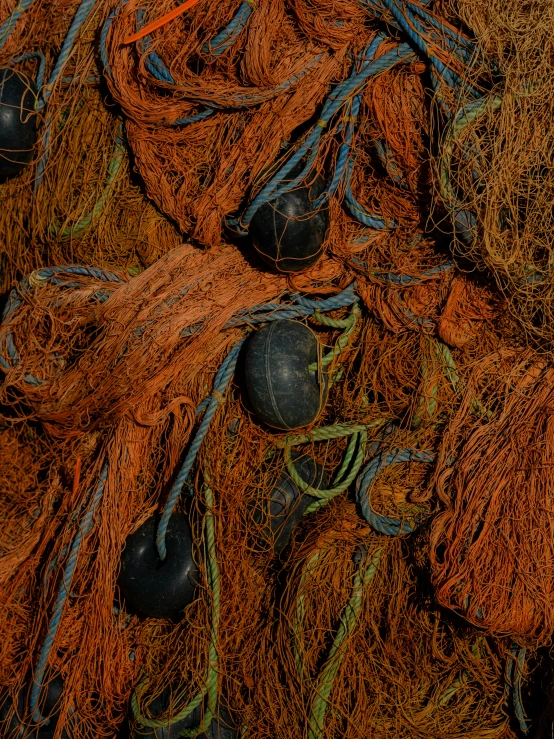 a group of pieces of orange woven material