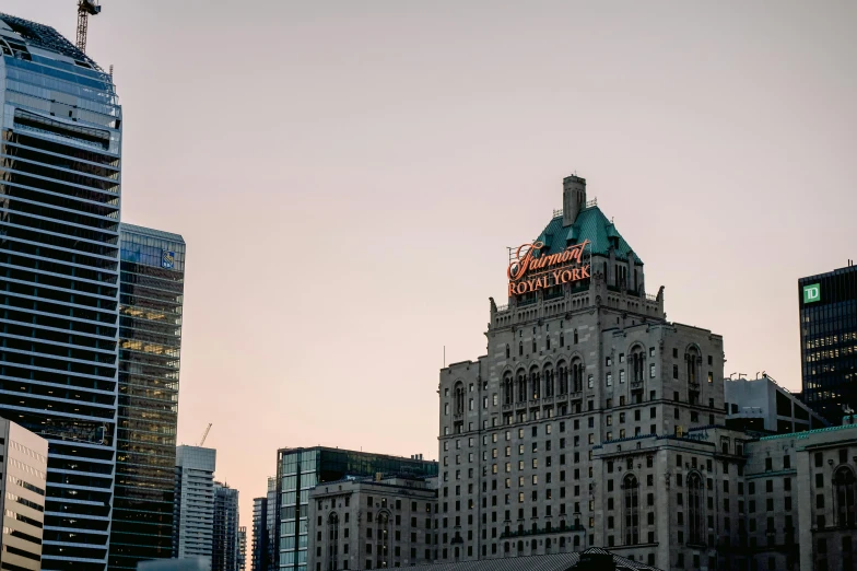 a large building in the middle of a city with tall buildings