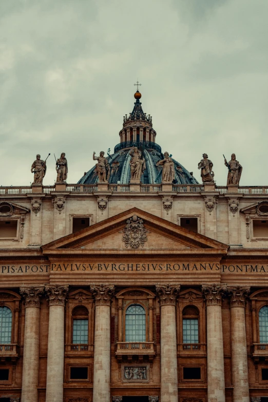 this large building has statues on the top of it