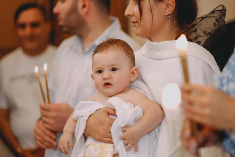 a small child being carried by an adult