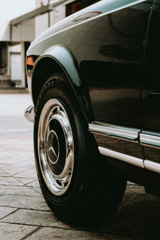 an automobile that is sitting on some tile