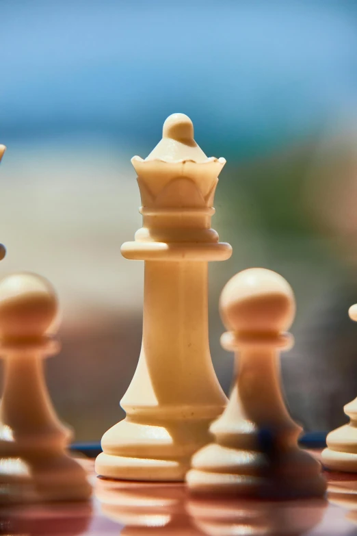 several white chess pieces on the board