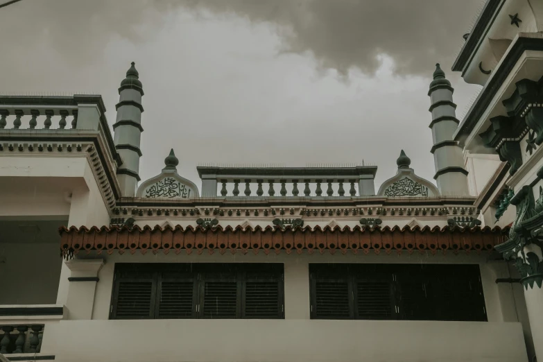 an ornately decorated building with two large domes