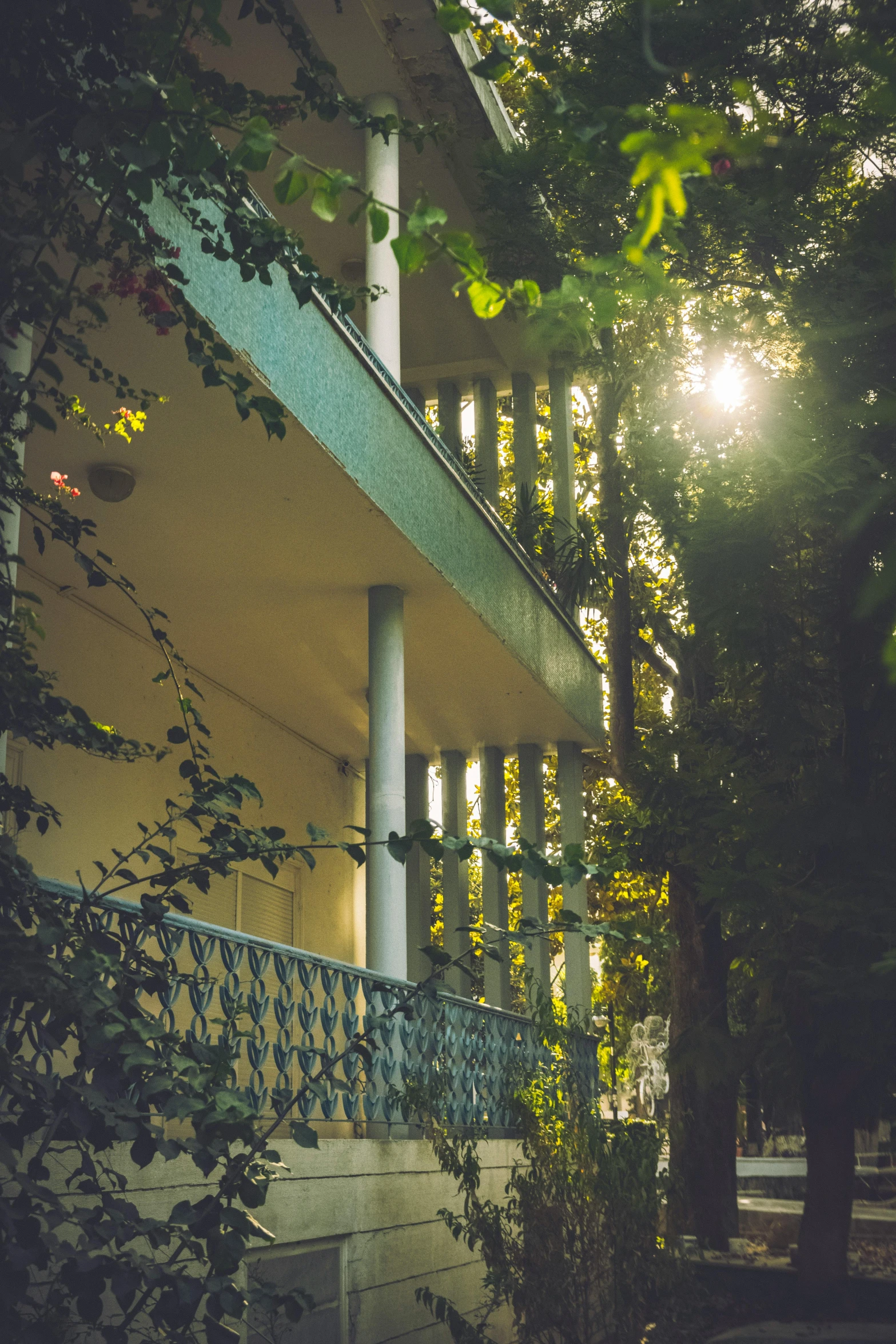 the sun is shining on the roof and front of a house