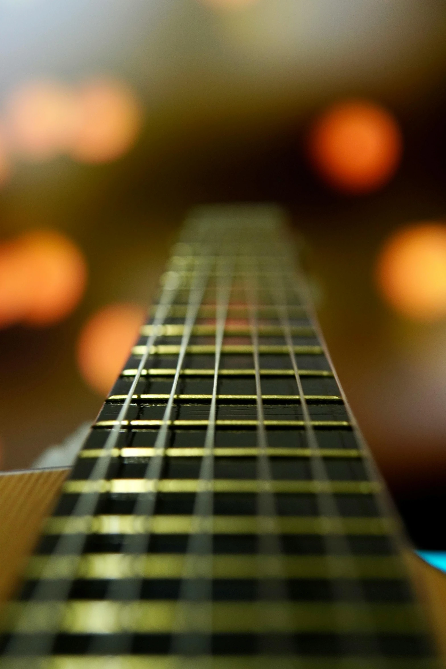 there is some blurry images that are on a guitar neck