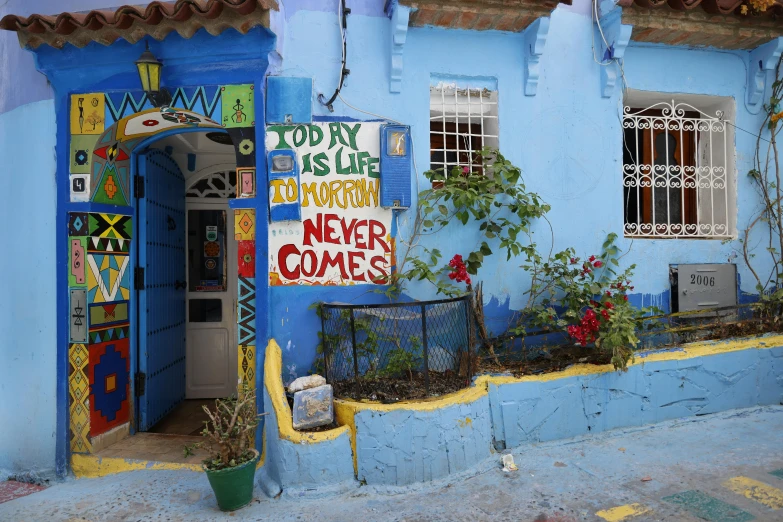 the corner of an outdoor building with potted plants