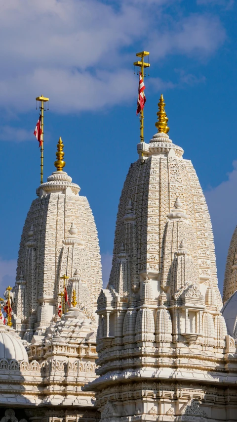 a row of white stone buildings under a blue sky