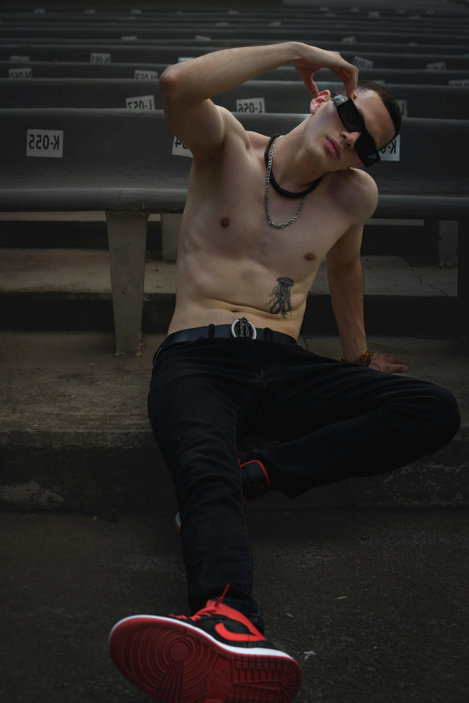 man with  sitting in bleachers