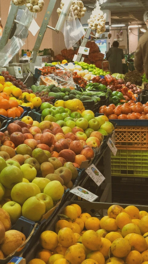 many fruits and vegetables are set out in baskets