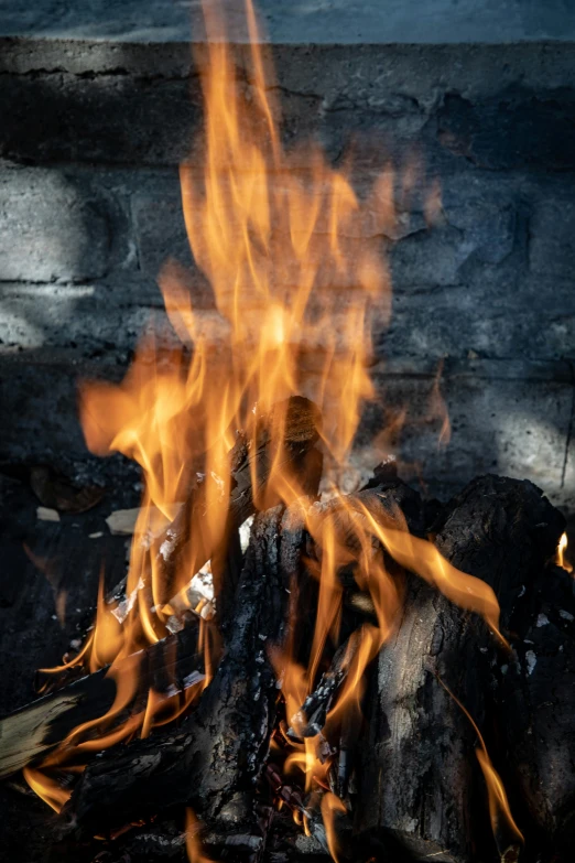 the flames of an outdoor stove are blazing