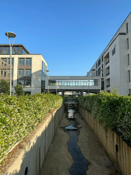 a couple of buildings and a bridge over a small river