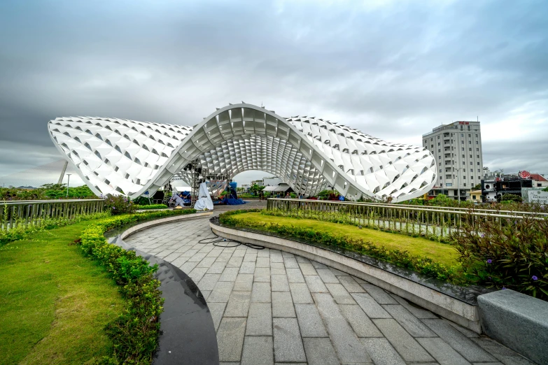 people are standing in front of a structure near the grass