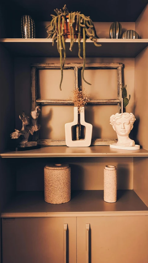 a display of different items on a wooden shelf