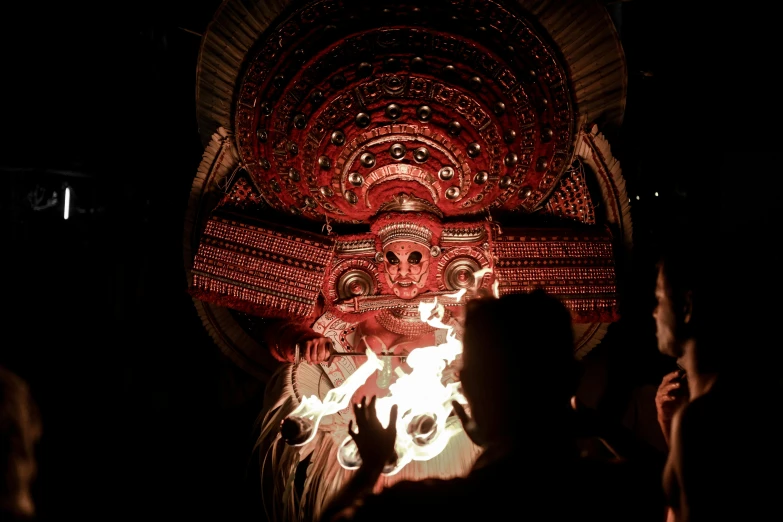 people standing around with a decorated display behind them