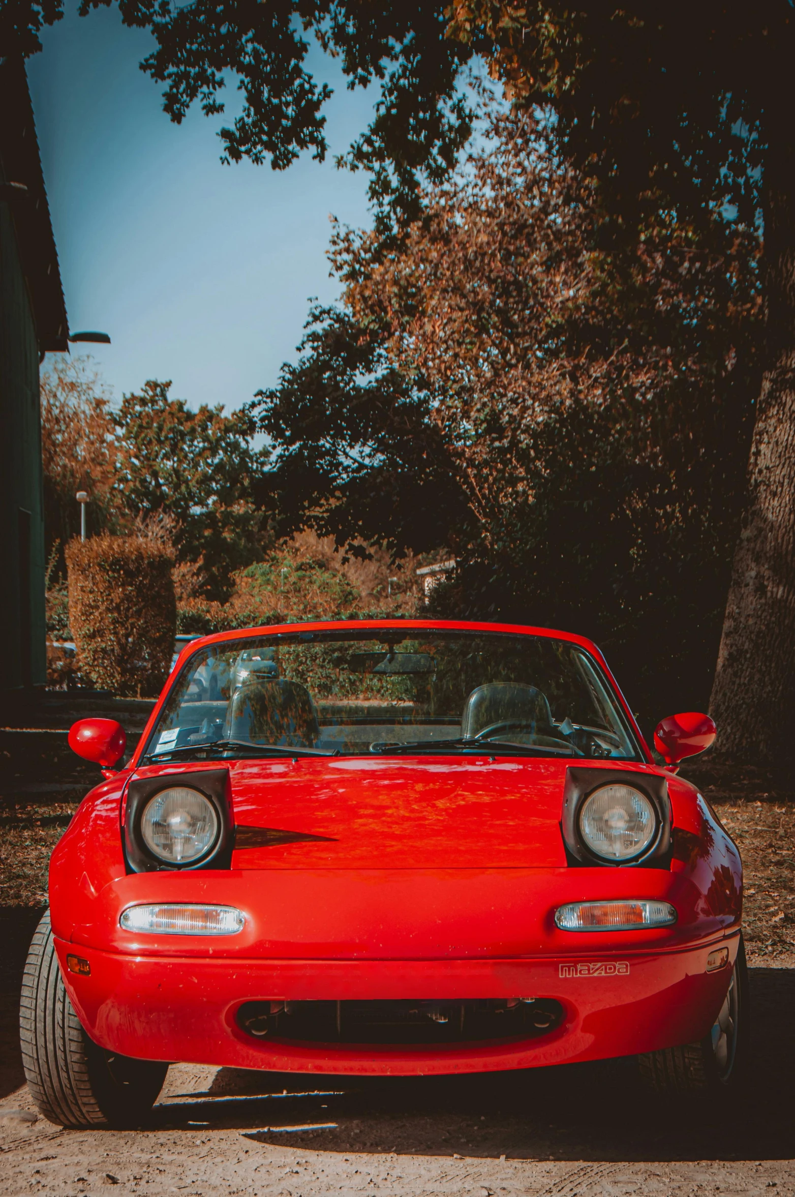 a car is parked in a parking lot on the street