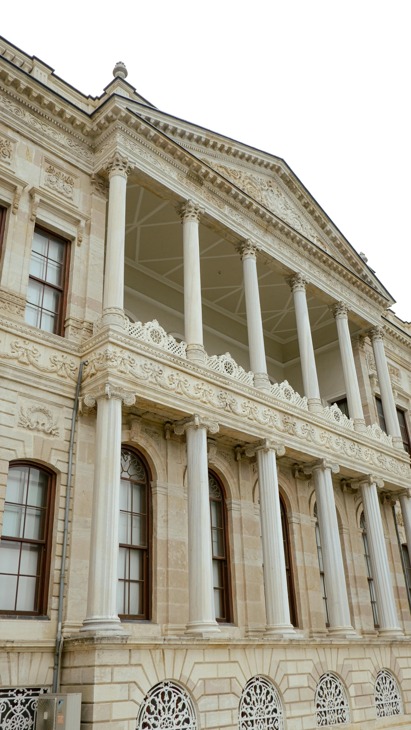 an old building with some pillars and round windows