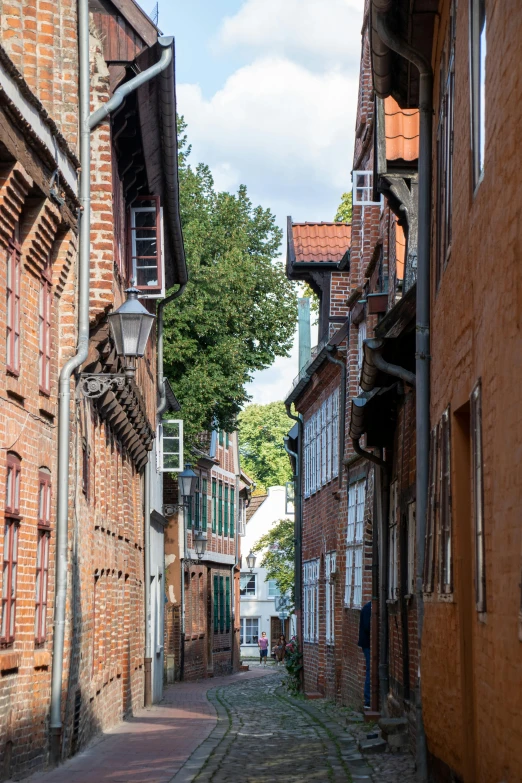 an old city street lined with brick buildings