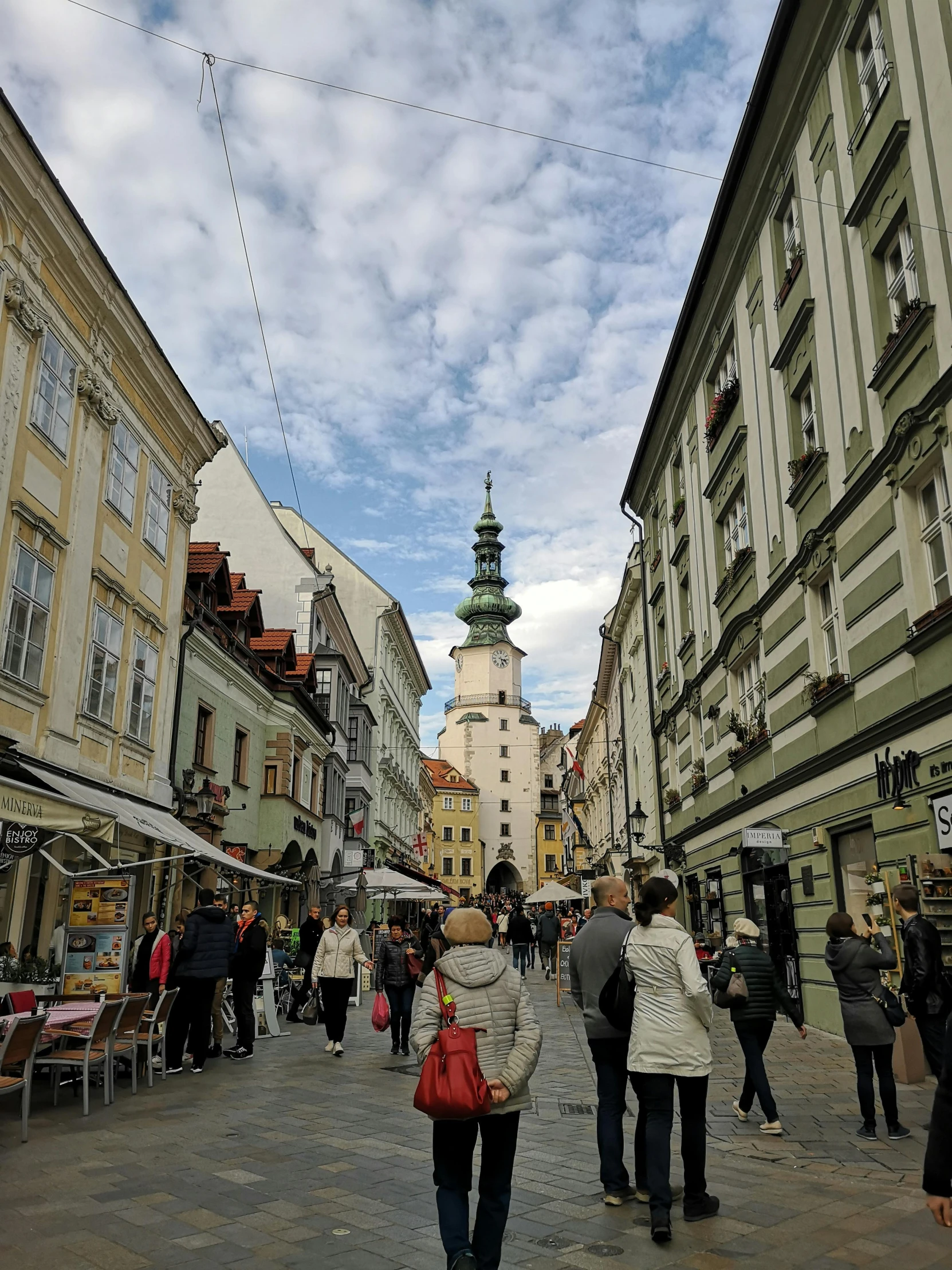 people walking on the street in a downtown area