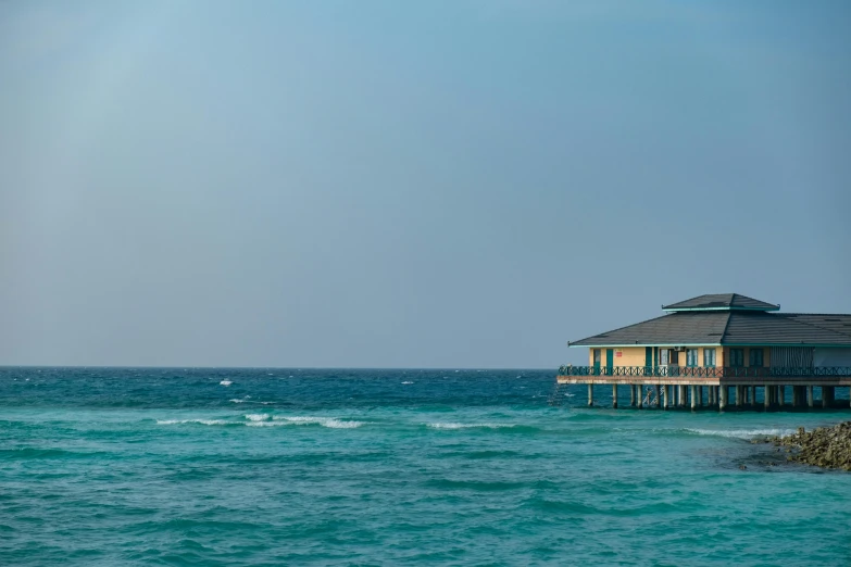 view of a house overlooking the water and a boat